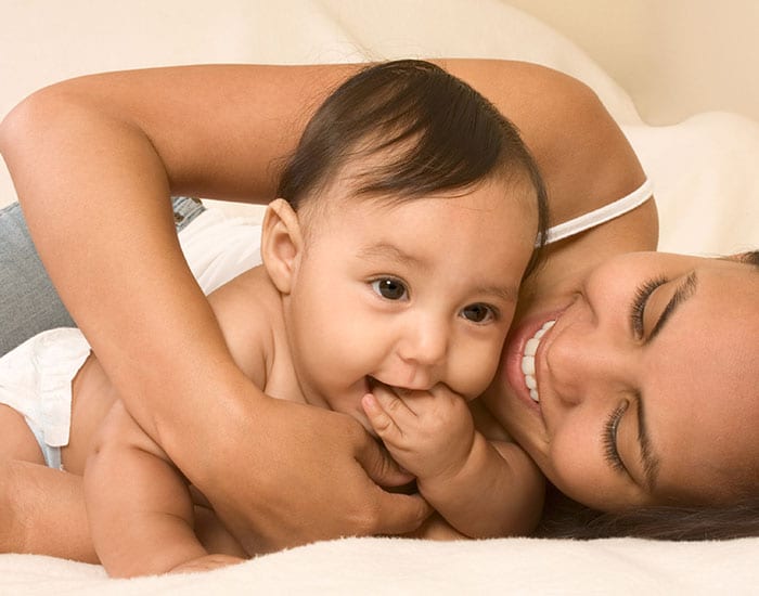 Mommy holding cute baby